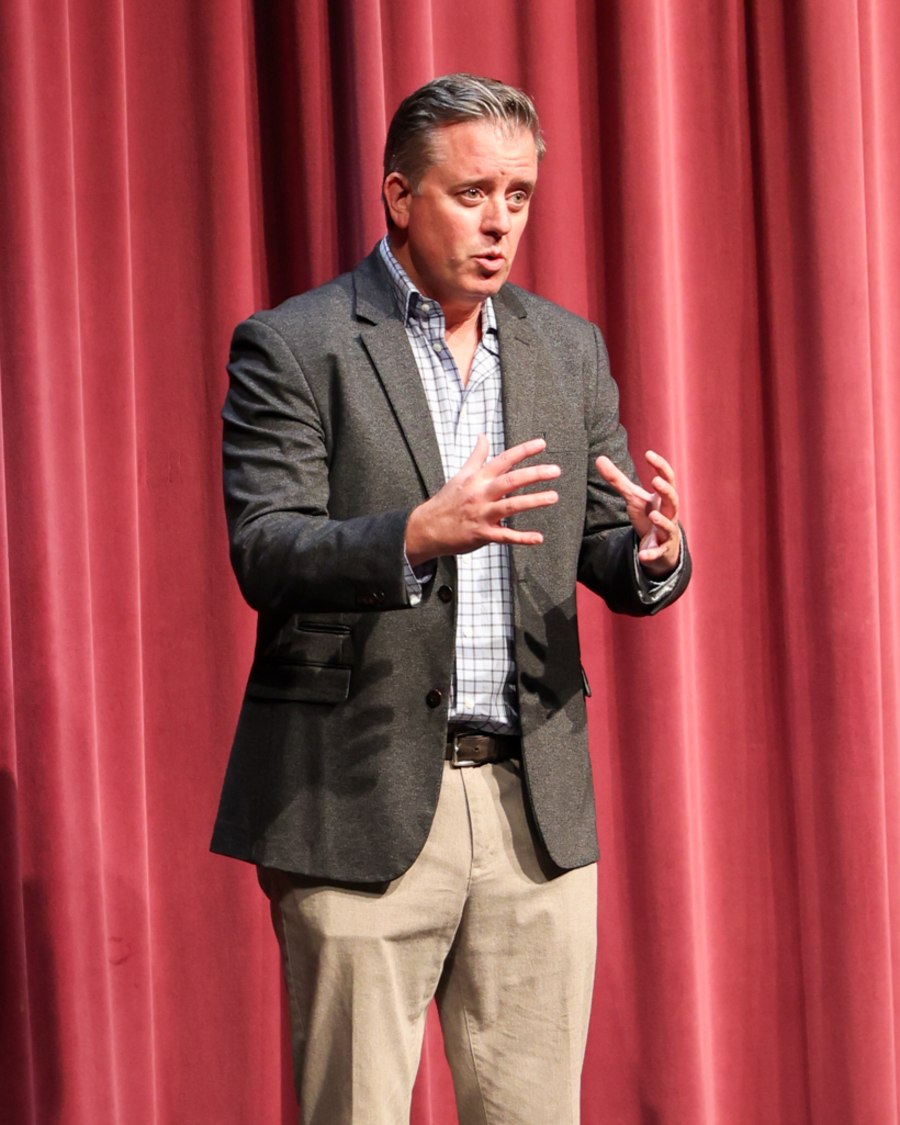 Seth Marlowe speaking on stage at a Pathbreaker Parenting talk